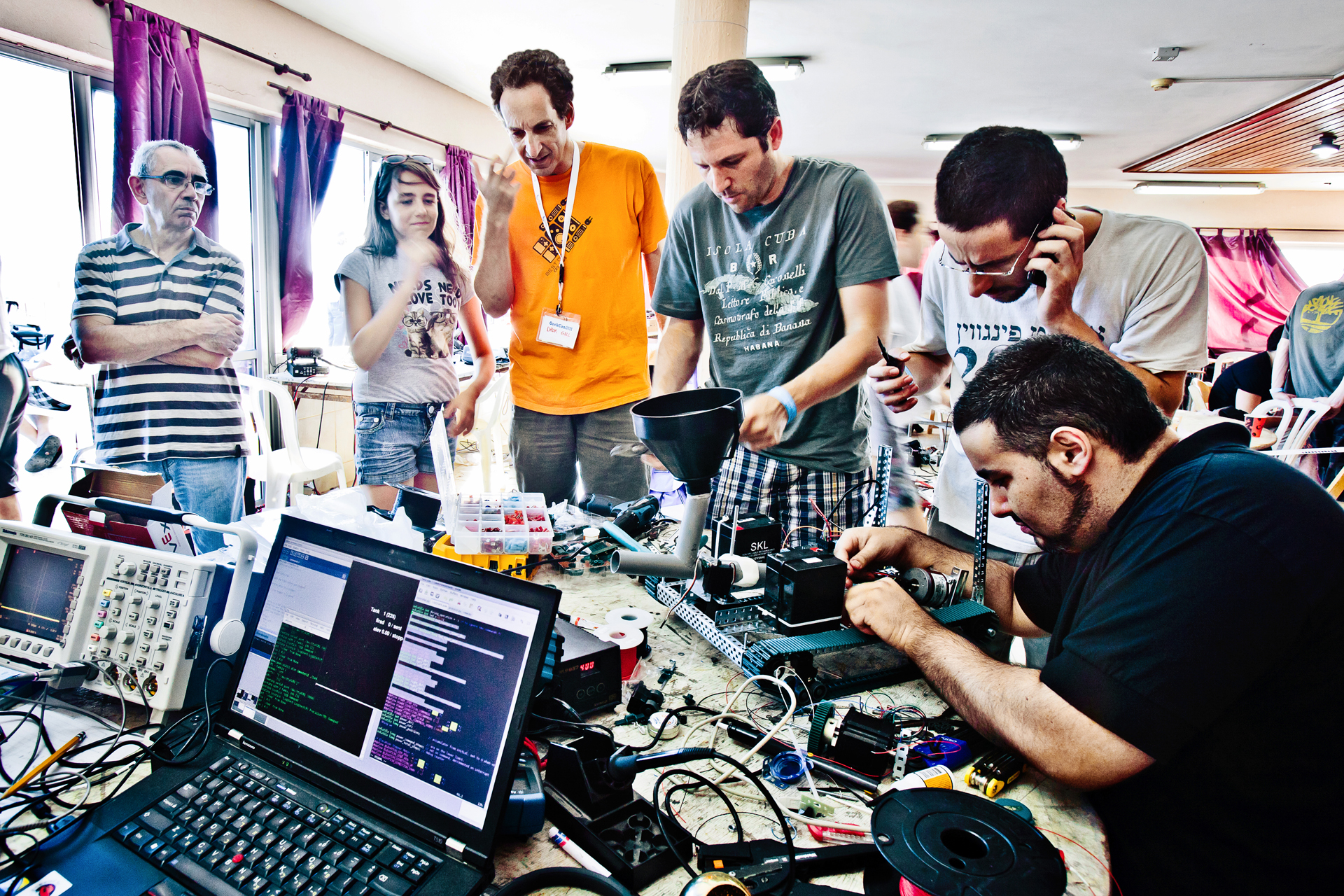 Hackers stand around their project at Geekcon 2011, Israel