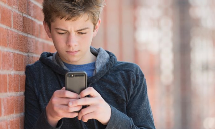 Boy using a mobile phone