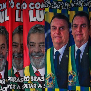 A photo of campaign posters for Lula and Bolsonaro