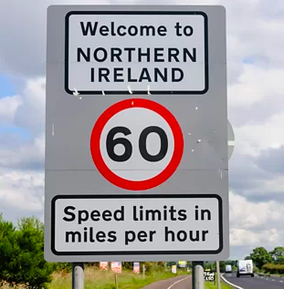 A roadsign saying "Welcome to Northern Ireland. Speed limits are in miles per hour"