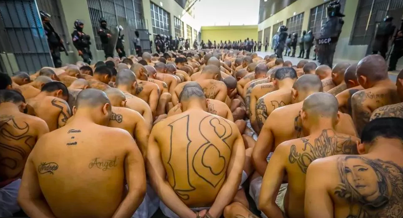 Prisoners lined up in rows in the floor of El Salvador's new supermax prison
