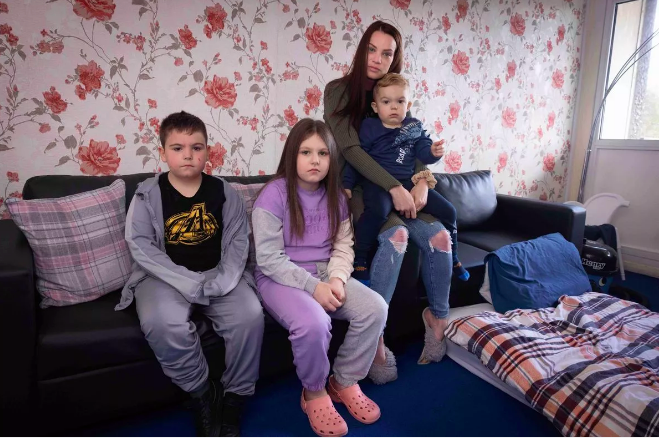 A mother and her three young children in temporary accommodation in Birmingham