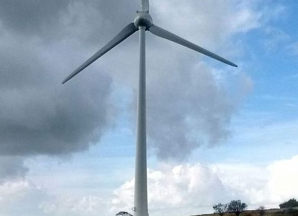 The Salem wind turbine against a cloudy sky
