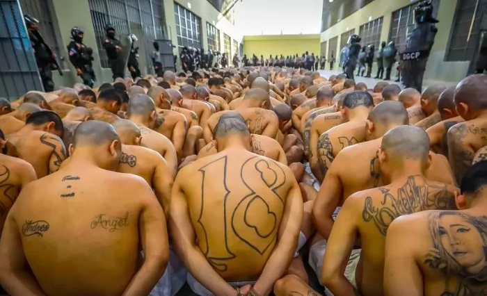 Prisoners lined up in rows in the floor of El Salvador's new supermax prison